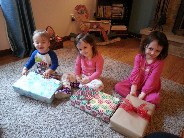 Getting ready to open their Christmas Eve presents.