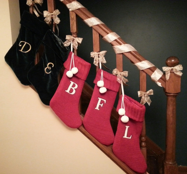 The stockings were hung from the...railing?...with care.