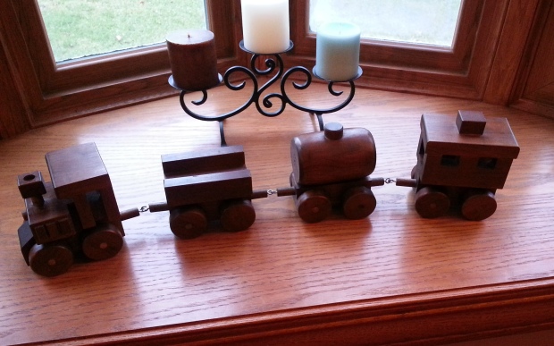 This awesome train he got used to be mine and was made by my Pawsie (Langston's great-great-grandfather)!
