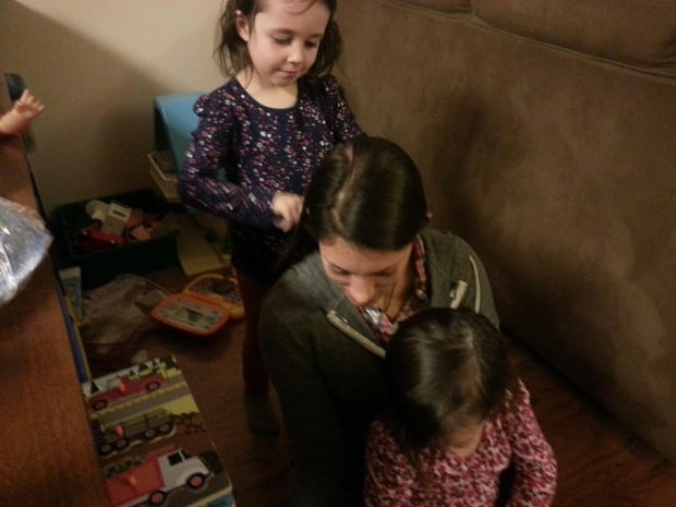 Brenna combing Aunt Kelsi's hair.